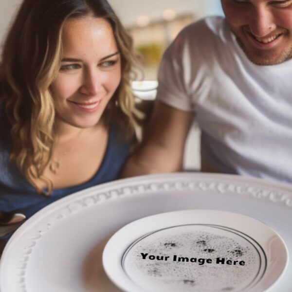 couple looking at a printed plates giving them ideas for their own printed dishware