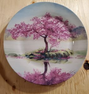 Custom printed porcelain plate featuring a cherry blossom tree design